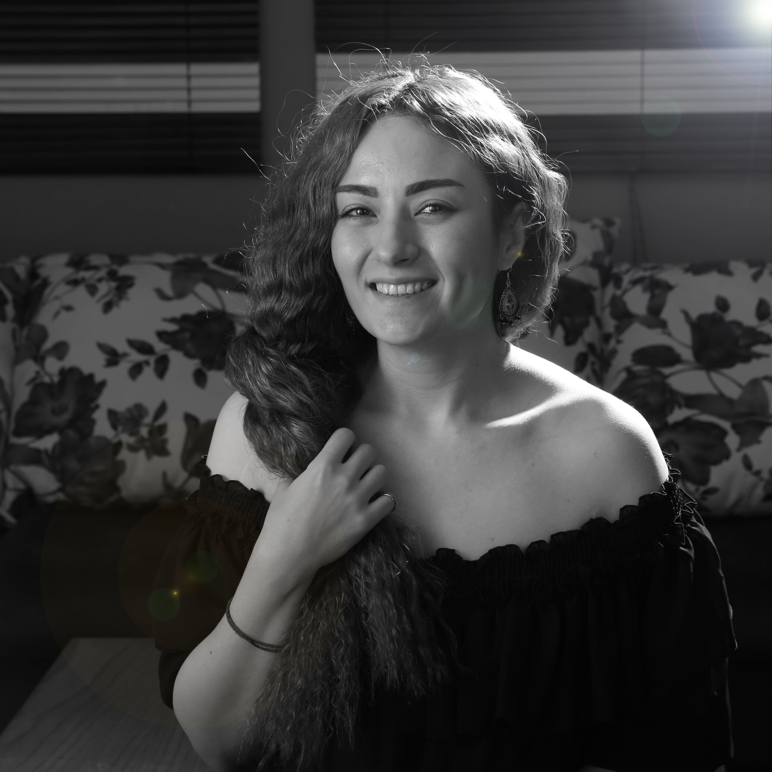 portrait-smiling-woman-sitting-sofa-home (1)